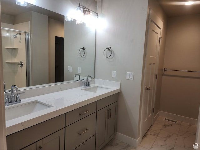 9786 N Aaron Ave E Unit 221, Eagle Mountain, UT 84005 - bathroom featuring marble finish floor, visible vents, a sink, and baseboards