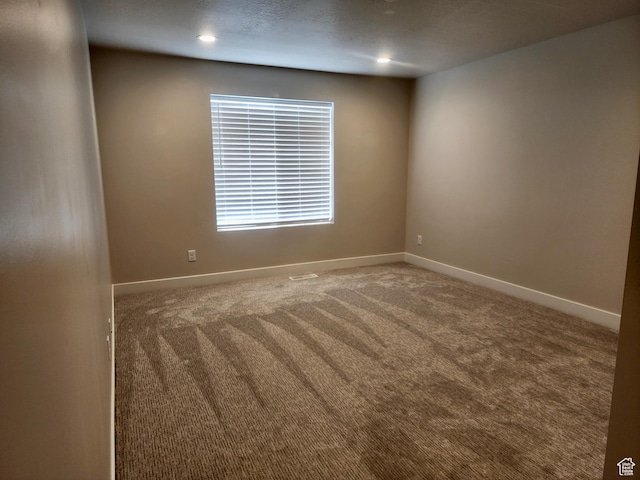 9786 N Aaron Ave E Unit 221, Eagle Mountain, UT 84005 - empty room featuring carpet flooring, baseboards, and recessed lighting