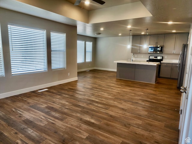 9786 N Aaron Ave E Unit 221, Eagle Mountain, UT 84005 - kitchen with a ceiling fan, appliances with stainless steel finishes, a sink, open floor plan, and baseboards