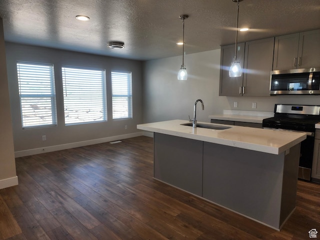 9786 N Aaron Ave E Unit 221, Eagle Mountain, UT 84005 - kitchen featuring stainless steel appliances, light countertops, a textured ceiling, and a sink