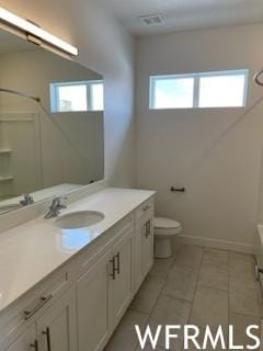 5508 W Victory Lap Ct S Unit 113, West Valley City, UT 84120 - bathroom featuring vanity, tile flooring, a healthy amount of sunlight, and toilet