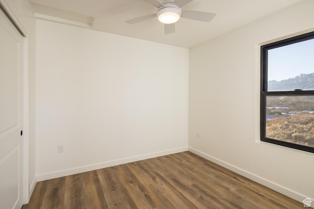 1185 S Murphy Ln Unit 105D, Moab, UT 84532 - empty room with wood finished floors, baseboards, and ceiling fan