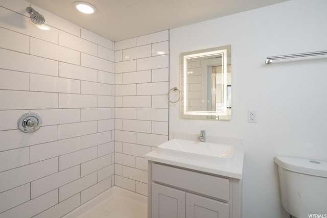 1185 S Murphy Ln Unit 106C, Moab, UT 84532 - bathroom featuring a tile shower, vanity, and toilet