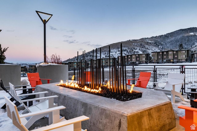 2417 W High Mountain Rd Unit 2109, Park City, UT 84098 - snow covered patio featuring a mountain view and an outdoor fire pit