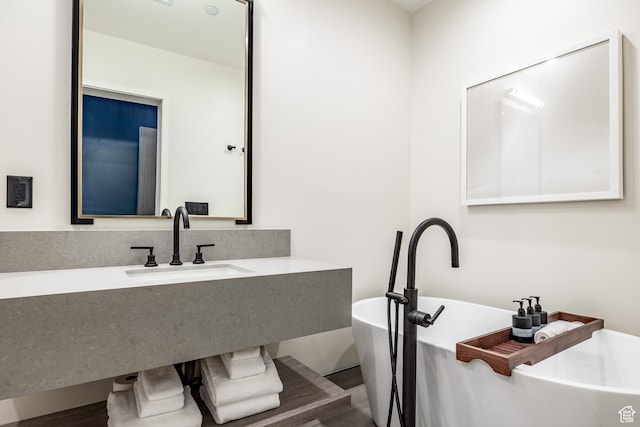 2417 W High Mountain Rd Unit 2109, Park City, UT 84098 - bathroom featuring hardwood / wood-style flooring, sink, and a bathtub