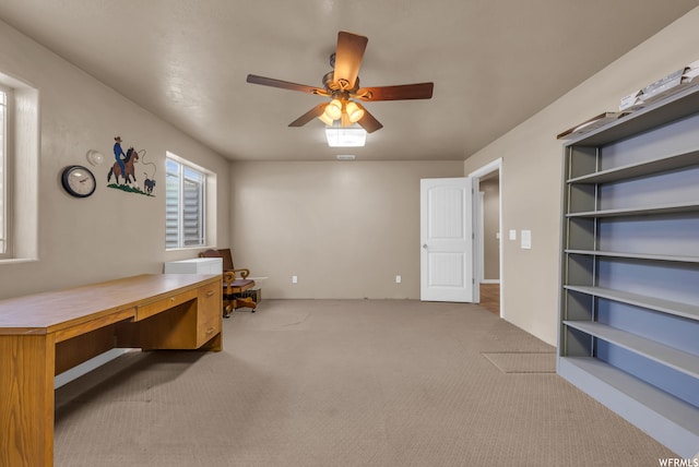 office with ceiling fan and light colored carpet