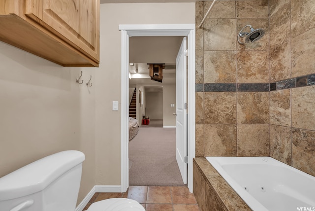 bathroom with toilet and tile floors