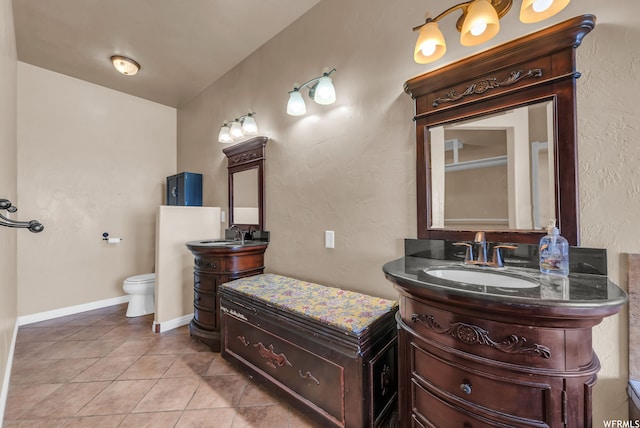bathroom featuring toilet, tile floors, and oversized vanity