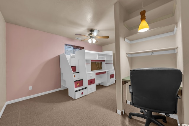 office area featuring light carpet and ceiling fan