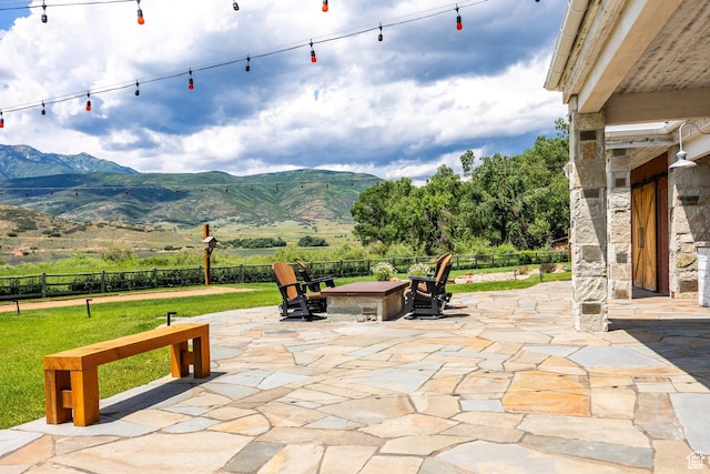 view of patio / terrace featuring a mountain view