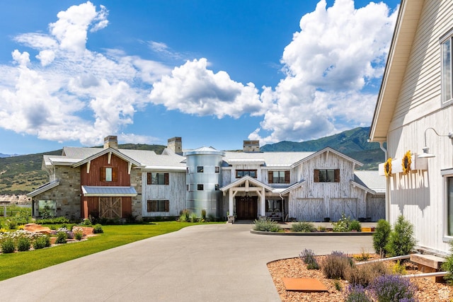 view of front facade with a mountain view and board and batten siding