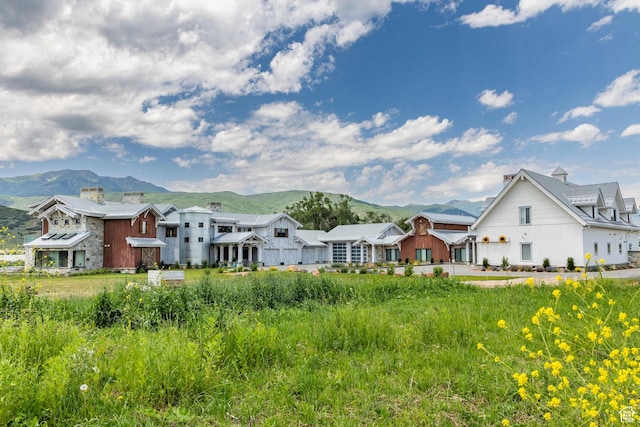 rear view of property featuring a mountain view