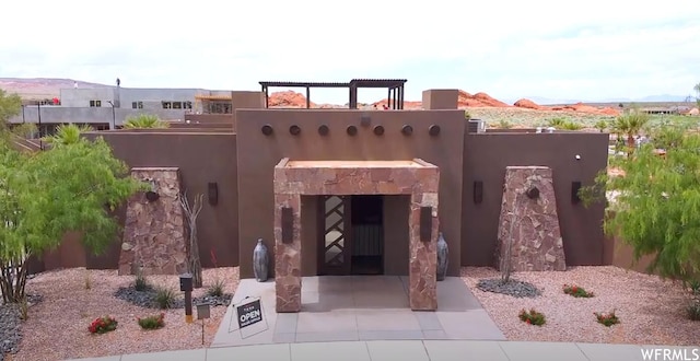 3210 S Dyami Vw Unit 60, Hurricane, UT 84737 - exterior space featuring an outdoor stone fireplace
