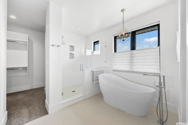 bathroom featuring tile floors and tiled shower