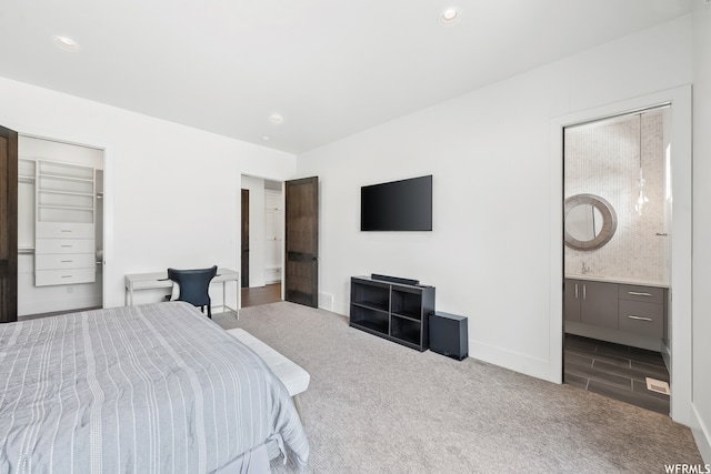 carpeted bedroom with ensuite bathroom