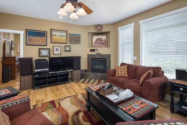 487 Kiva Dr, Moab, UT 84532 - living room featuring ceiling fan, a tile fireplace, and light hardwood / wood-style flooring