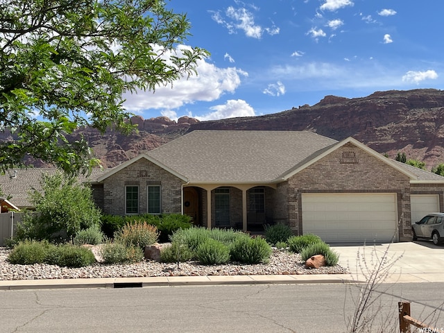 487 Kiva Dr, Moab, UT 84532 - single story home with a mountain view and a garage