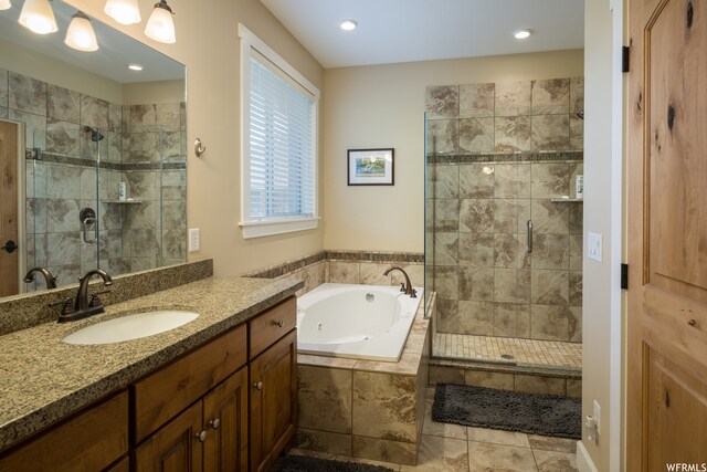 487 Kiva Dr, Moab, UT 84532 - bathroom featuring plus walk in shower, tile floors, and vanity with extensive cabinet space