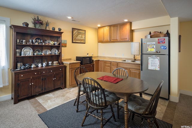 487 Kiva Dr, Moab, UT 84532 - dining room featuring sink and light colored carpet