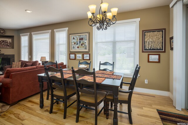 487 Kiva Dr, Moab, UT 84532 - dining area with an inviting chandelier and light hardwood / wood-style floors