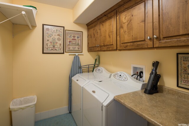 487 Kiva Dr, Moab, UT 84532 - clothes washing area with hookup for a washing machine, tile flooring, separate washer and dryer, and cabinets