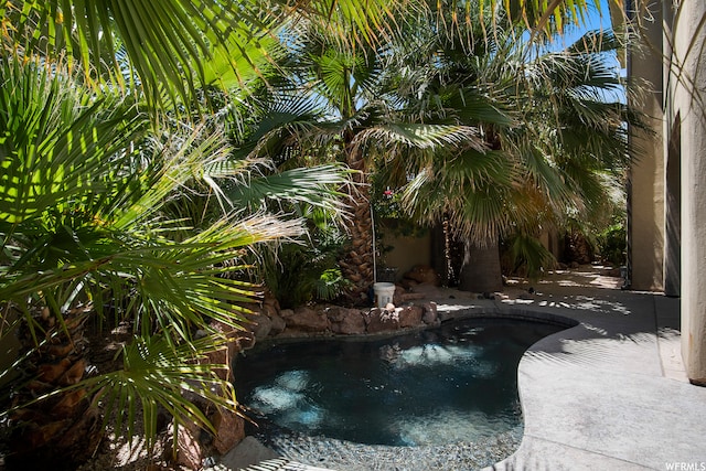 view of swimming pool with a patio area