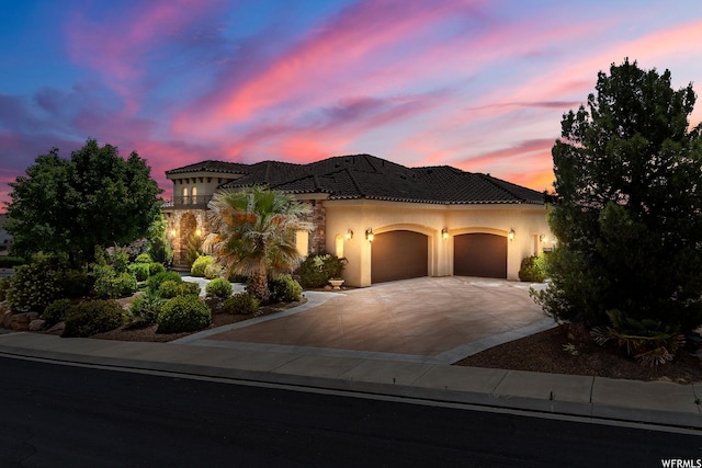 mediterranean / spanish house featuring a garage
