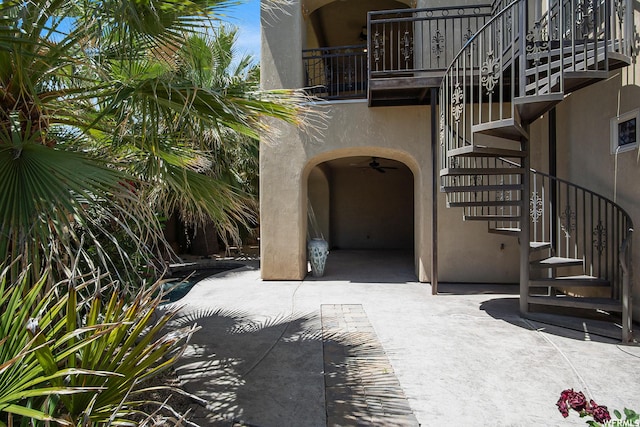 exterior space with ceiling fan
