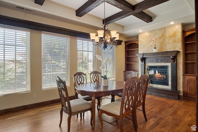 dining room with a fireplace, beam ceiling, dark hardwood / wood-style floors, and coffered ceiling
