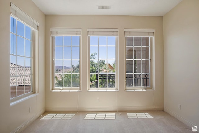 interior space featuring light colored carpet