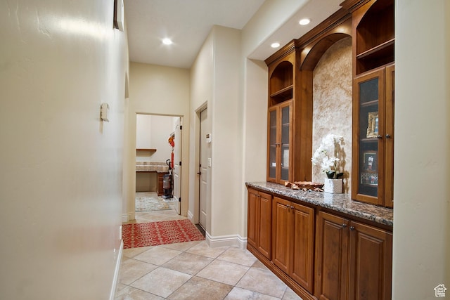 hallway featuring light tile patterned floors