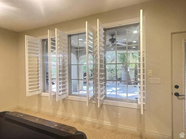 doorway featuring ceiling fan