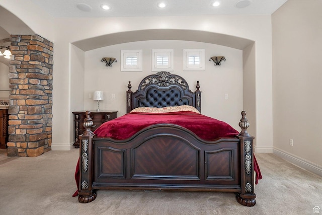 bedroom featuring light colored carpet