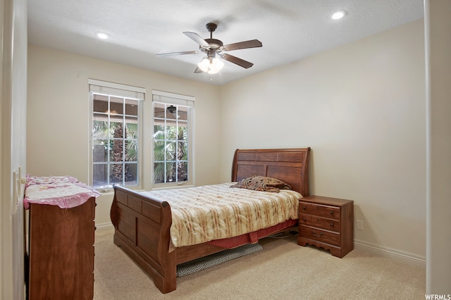 carpeted bedroom with ceiling fan