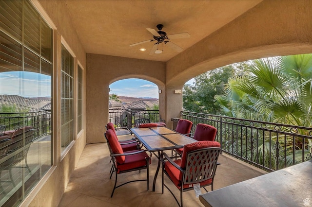 view of patio / terrace featuring ceiling fan and a balcony