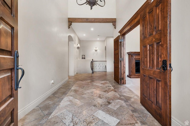 foyer featuring a towering ceiling