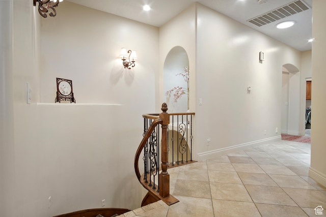 hall featuring light tile patterned floors