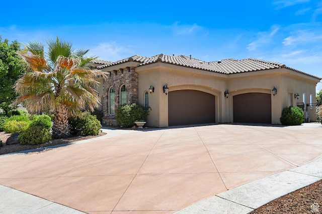 mediterranean / spanish-style home featuring a garage