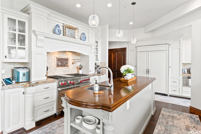 4159 Moose Hollow Rd, Park City, UT 84098 - kitchen featuring white cabinets, sink, tasteful backsplash, and premium appliances