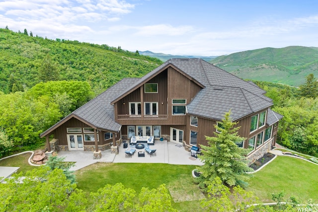 4159 Moose Hollow Rd, Park City, UT 84098 - back of property with a mountain view, french doors, a yard, and a patio area