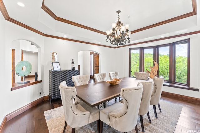 4159 Moose Hollow Rd, Park City, UT 84098 - dining space featuring a notable chandelier, dark wood-type flooring, ornamental molding, and a tray ceiling