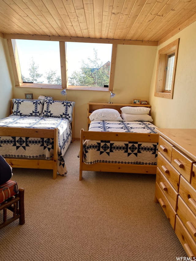 bedroom with light carpet and wood ceiling