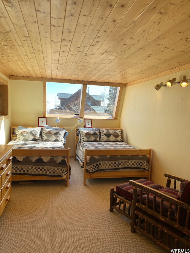 bedroom featuring wood ceiling and carpet floors