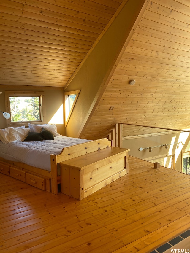 unfurnished bedroom with hardwood / wood-style floors, lofted ceiling, wood ceiling, and wooden walls