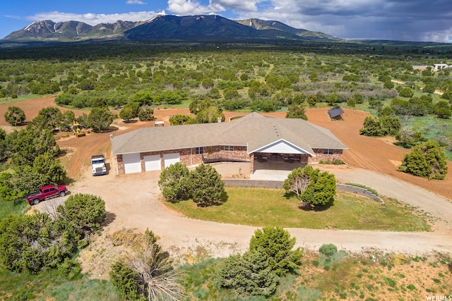 birds eye view of property featuring a mountain view