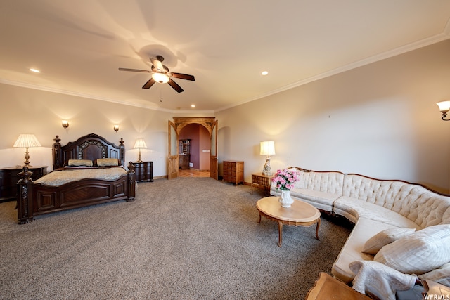 carpeted bedroom with ornamental molding and ceiling fan