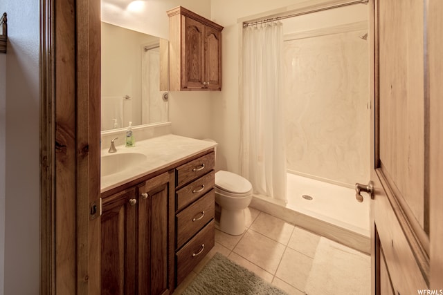 bathroom featuring toilet, tile floors, a shower with shower curtain, and oversized vanity