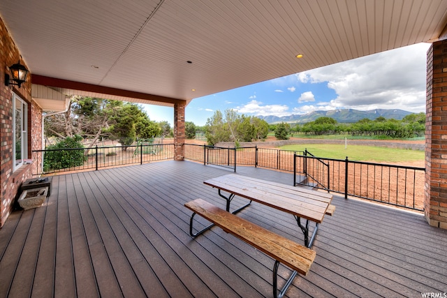 wooden deck featuring a mountain view