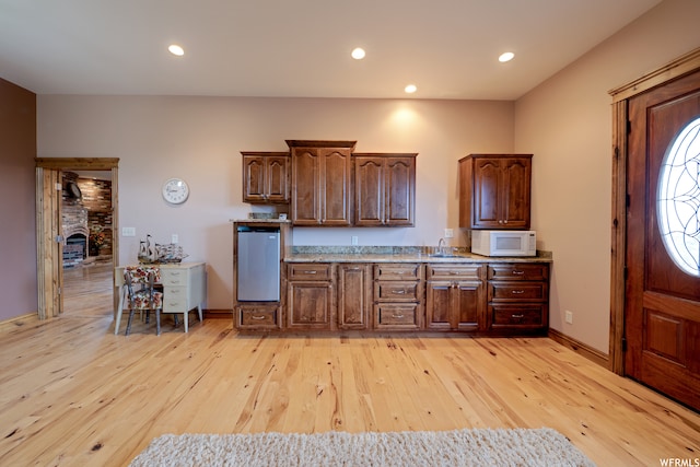 kitchen with sink and light wood-type flooring
