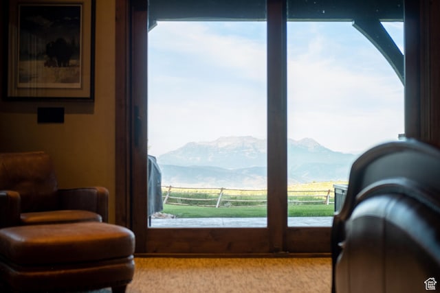 sitting room featuring a mountain view